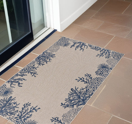 2' X 3' Beige and Blue Coral Stain Resistant Indoor Outdoor Area Rug