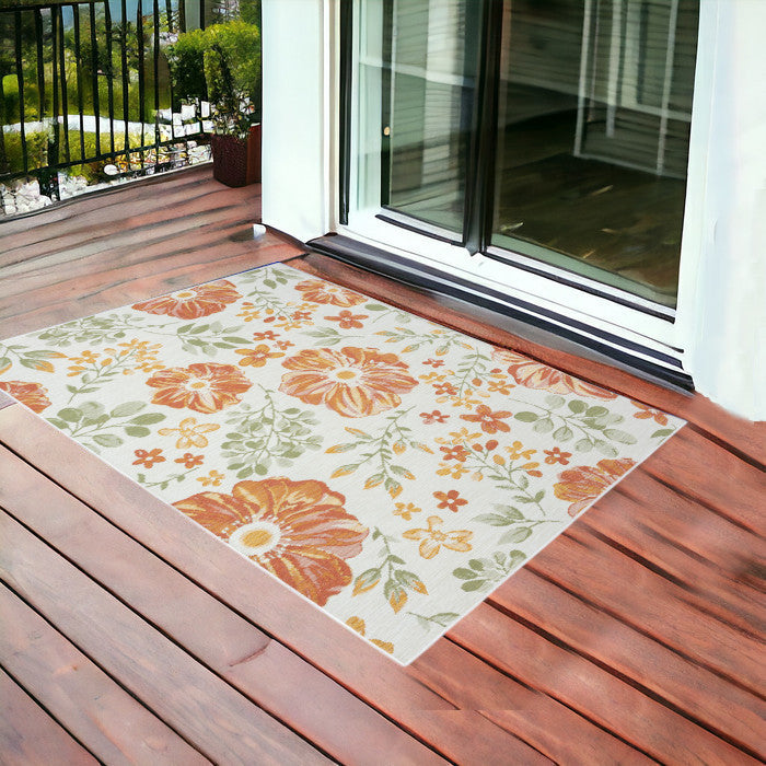 2' X 3' Ivory Green and Orange Floral Stain Resistant Indoor Outdoor Area Rug