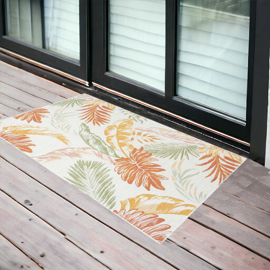 2' X 3' Ivory Green and Orange Palm Leaf Stain Resistant Indoor Outdoor Area Rug
