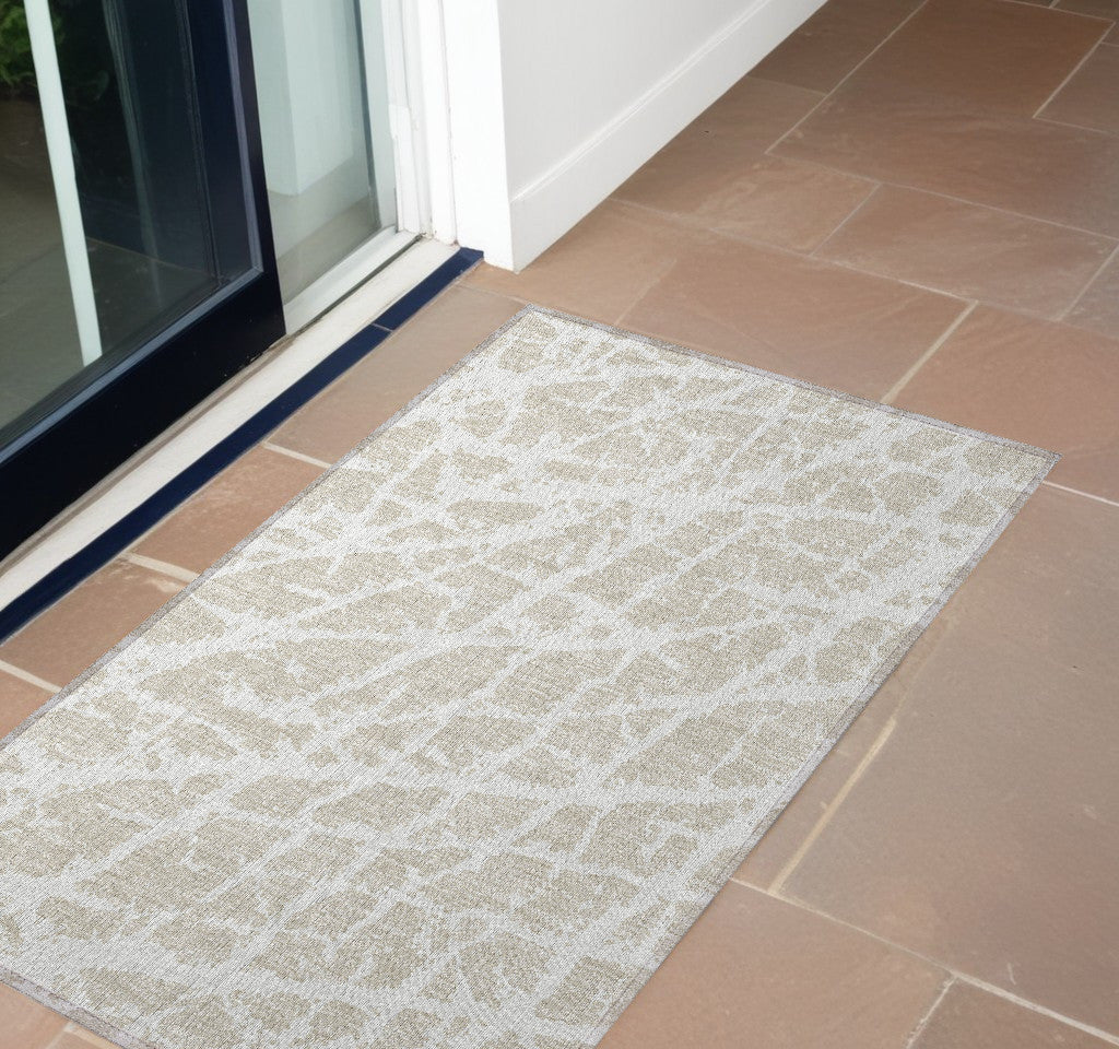 2' X 3' Beige and Ivory Abstract Washable Non Skid Indoor Outdoor Area Rug