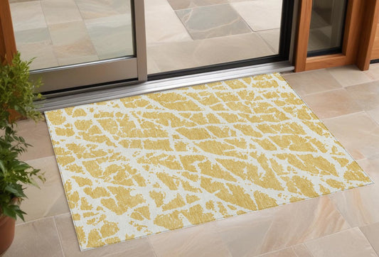 2' X 3' Gold and White Abstract Washable Non Skid Indoor Outdoor Area Rug