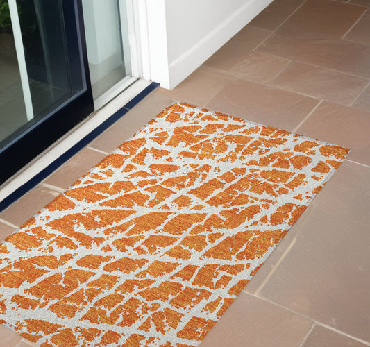 2' X 3' Orange and White Abstract Washable Non Skid Indoor Outdoor Area Rug