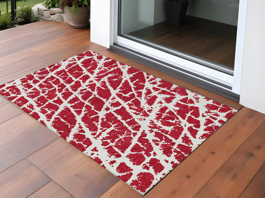 2' X 3' Red and White Abstract Washable Non Skid Indoor Outdoor Area Rug