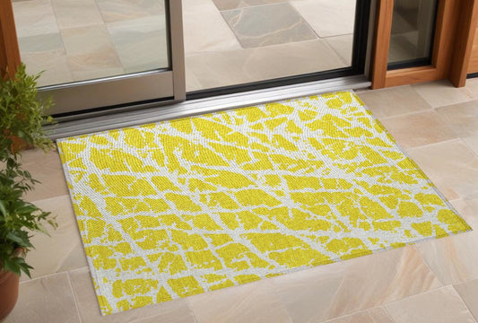 2' X 3' Yellow and White Abstract Washable Non Skid Indoor Outdoor Area Rug