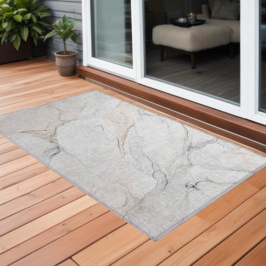 2' X 3' Beige Ivory and Gray Abstract Washable Non Skid Indoor Outdoor Area Rug