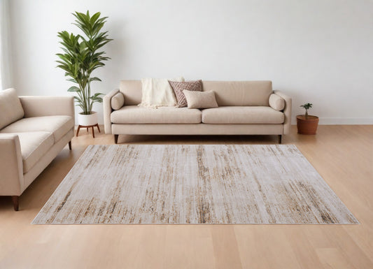 9' X 13' Ivory and Tan Abstract Power Loom Worn Faded Area Rug