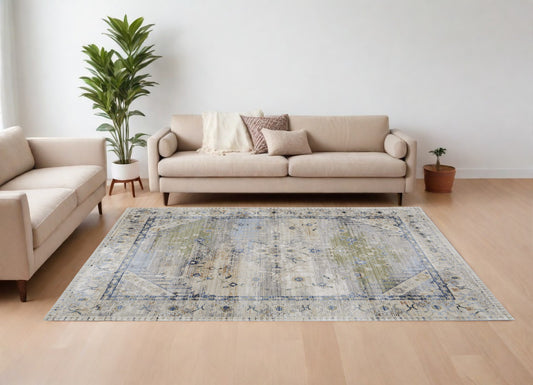 9' X 13' Ivory Green and Blue Abstract Power Loom Worn Faded Area Rug